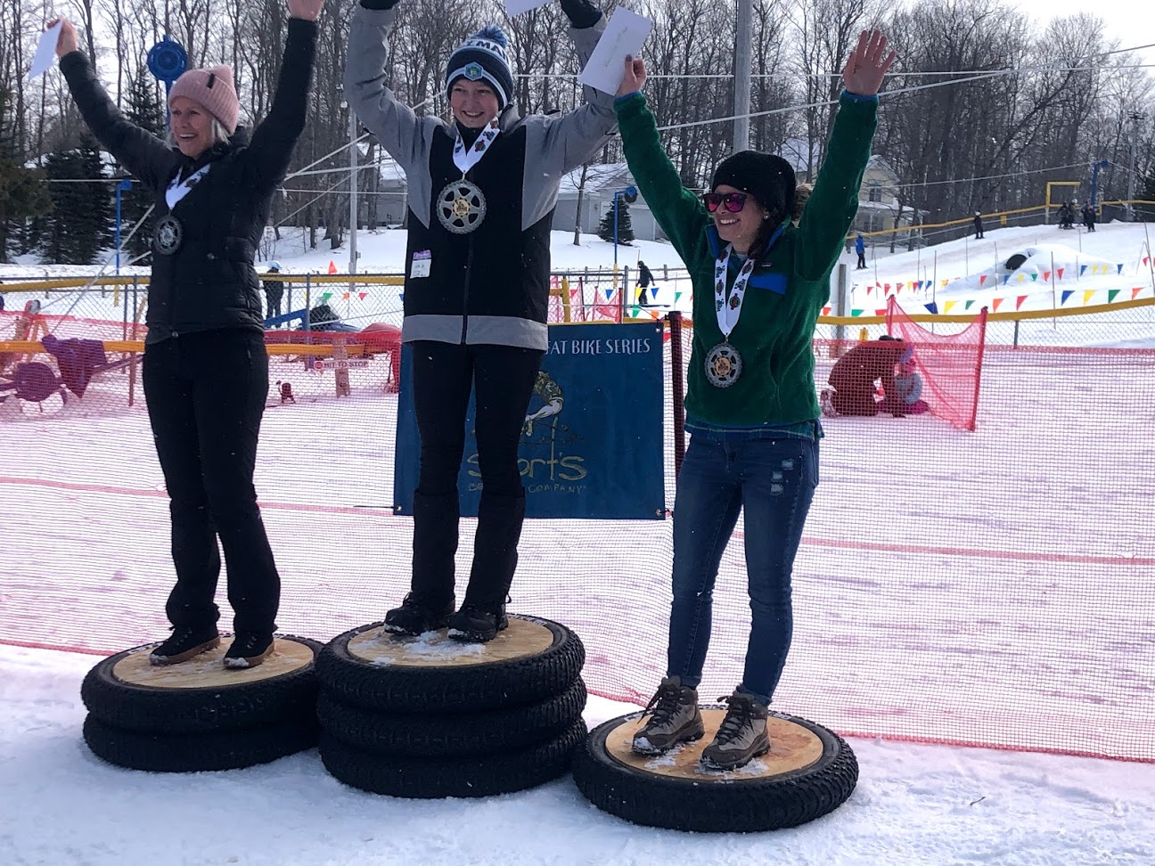 Podium Picture of three women after a fat bike snow race